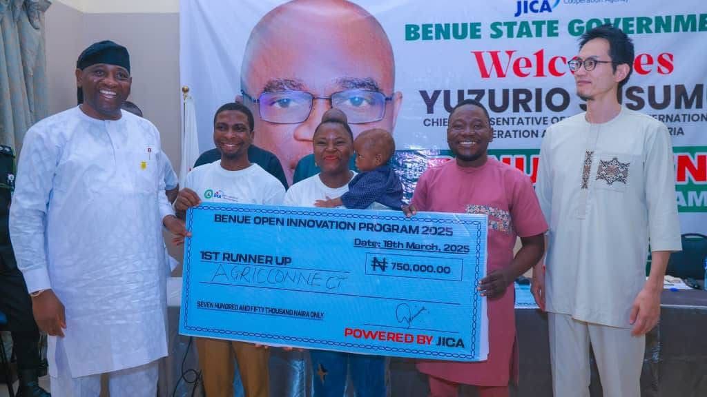 Cheque presentation at a partnership event